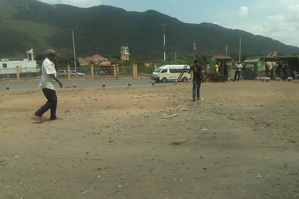 People and a minibus at the Namanga border area between Tanzania and Kenya.