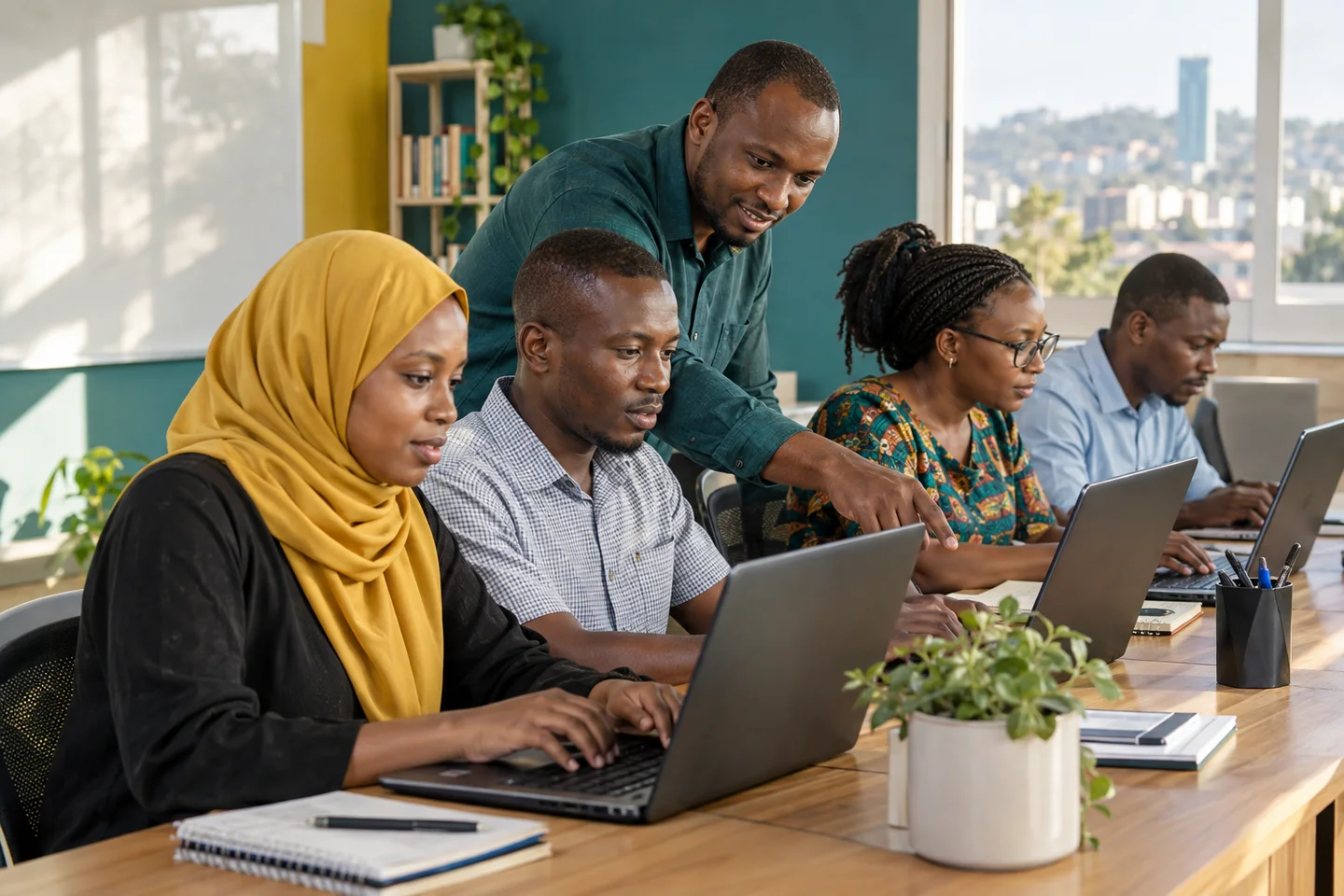 Editorial illustration: Adults practising computer skills with a trainer.